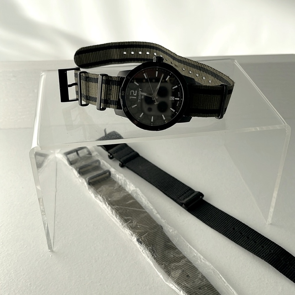 TISSOT MENS BLACK WATCH WITH OLIVE GREEN BAND.